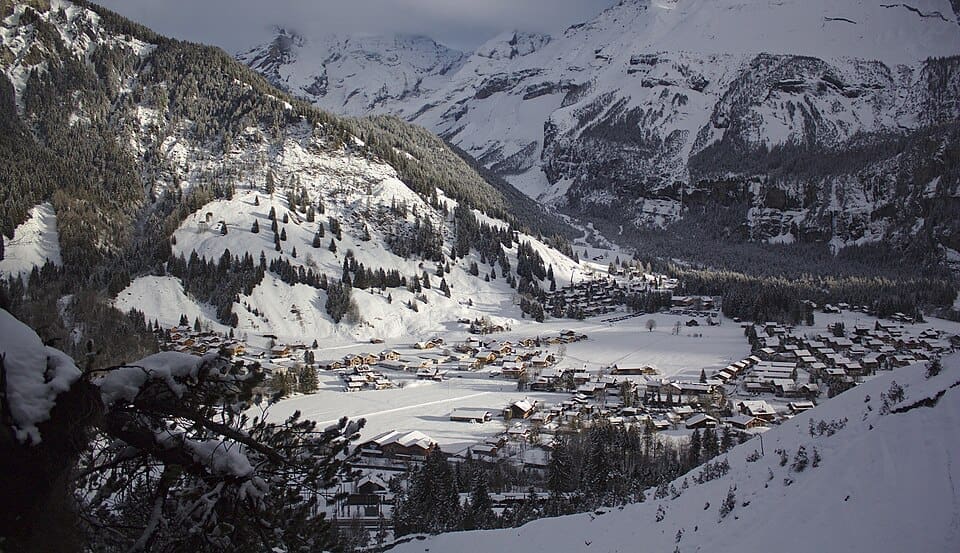View at Kandersteg in winter, with the last sunshine of the day reaching the village