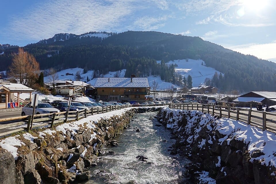 Snow-covered village of Le Chinaillon in Le Grand-Bornand under a clear blue sky