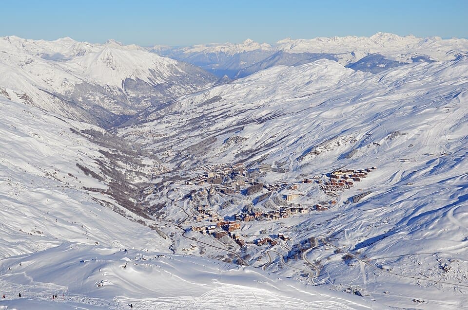 Panoramic view of Les Menuires resort buildings and the Belleville valley in winter