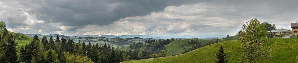 Panoramic landscape of the Lucerne canton near Hergiswil with alpine peaks in the background