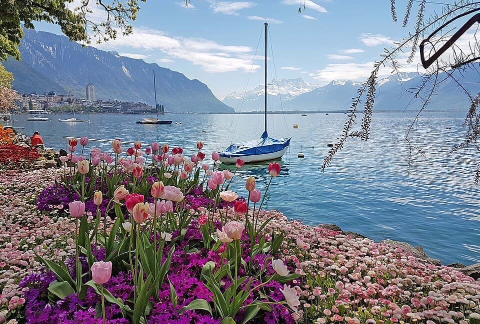 Montreux Riviera with sailboat on Lake Geneva