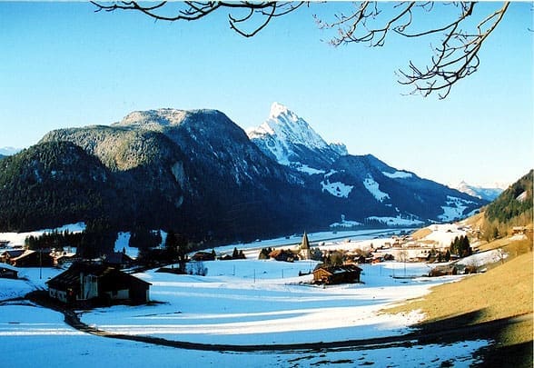Saanen village in winter covered in snow