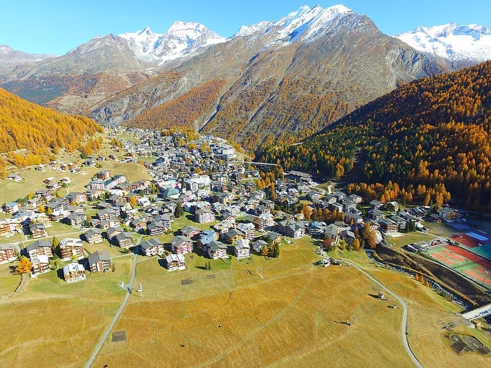 Aerial view of the Saas-Fee village and surrounding alpine mountains in winter