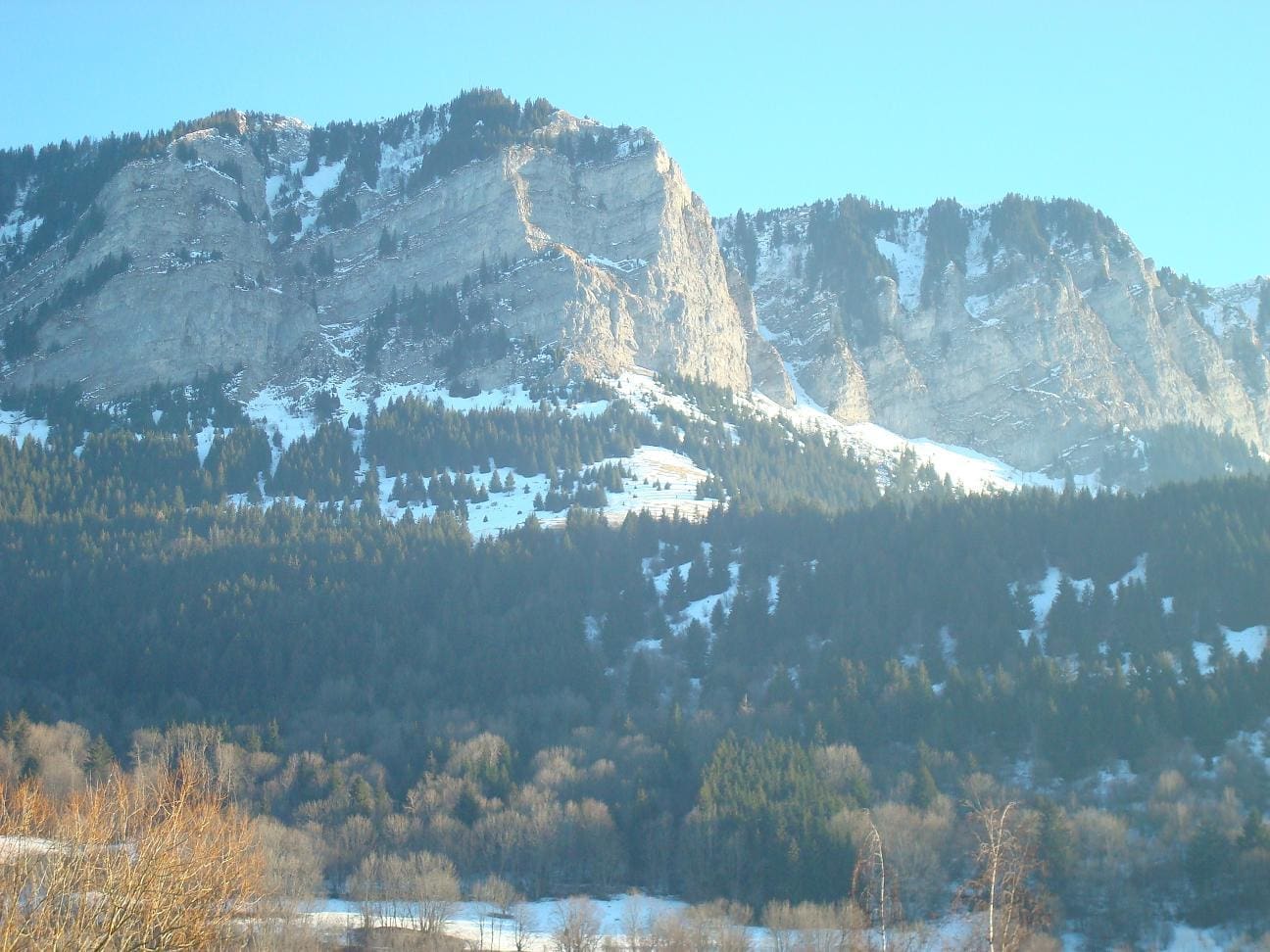 Winter view of Montagne de Mémises from the hamlet of Sur le Crêt
