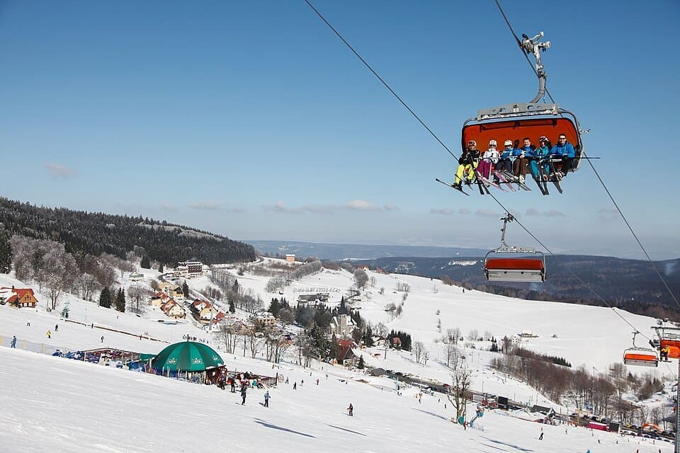 Zieleniec Ski Arena in full winter season showing chairlifts and snowy slopes